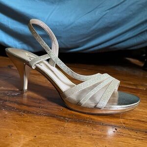 Nina. Slivery gold. Makes a good prom shoe. Serious offers only.